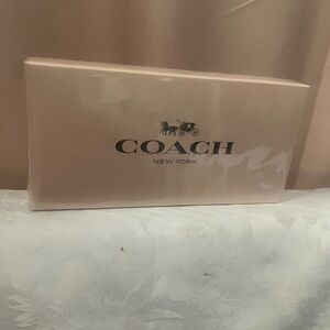 Brand new, still in cellophane wrapping. Coach New York mini perfume set